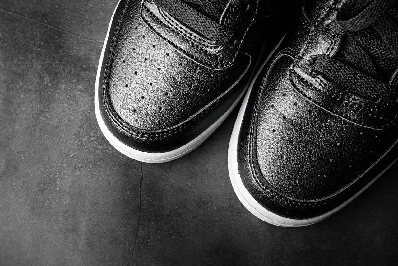 Black leather sports shoes close-up style